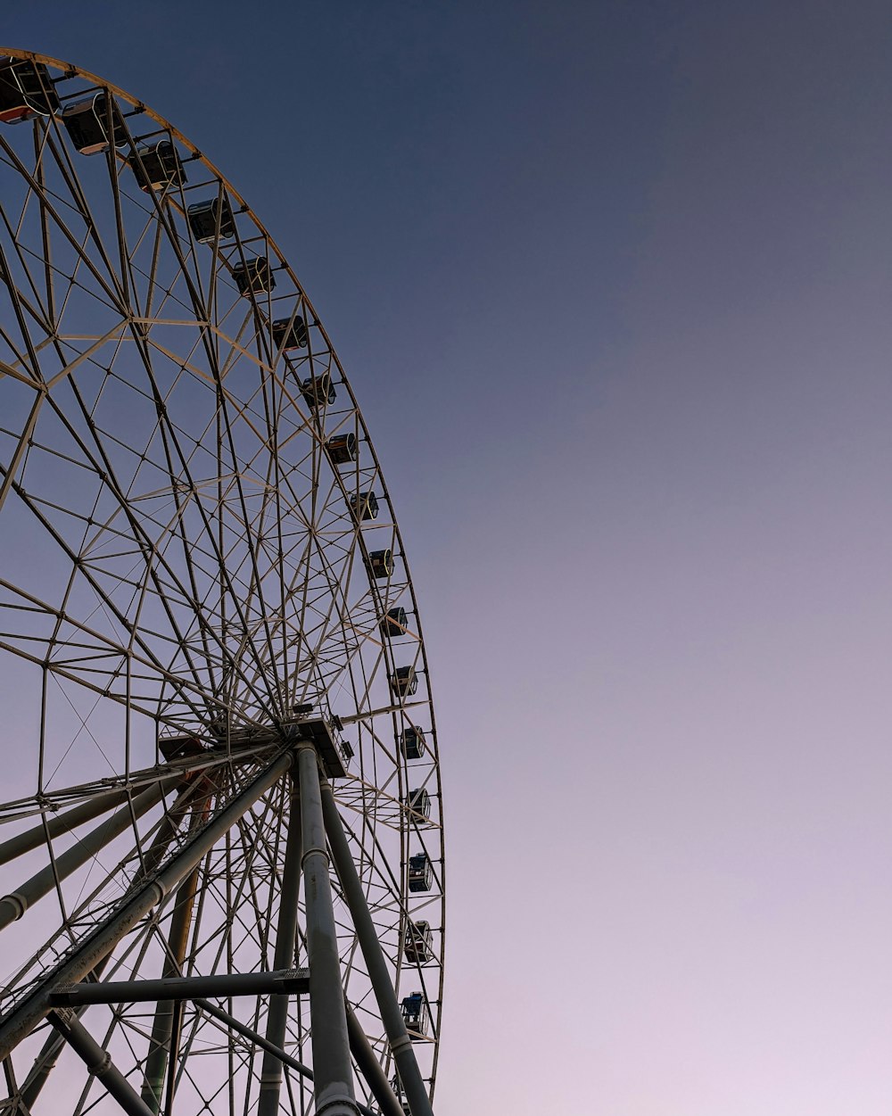 a large ferris wheel sitting on top of a field