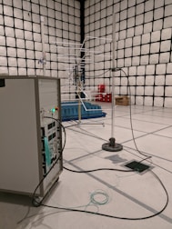 An acoustic testing room with soundproof panels and advanced audio equipment.