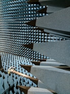 Interior view of a spacious anechoic chamber with foam wedges lining the walls