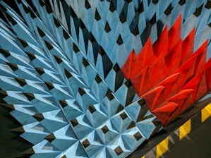 Colorful triangular patterns inspired by Rarámuri clothing in blue, red, and yellow.