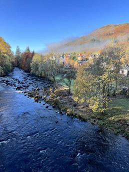 A serene riverside village in the Blaisois region during autumn.