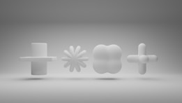 Four abstract white 3D shapes are suspended against a gray gradient background. The shapes, from left to right, include a cylindrical cross, a flower-like shape with multiple petals, a rounded clover-like form, and a sphere intersected by perpendicular cylindrical arms.