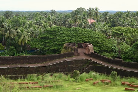 Historic Spanish fortifications on Mancera Island surrounded by lush greenery.