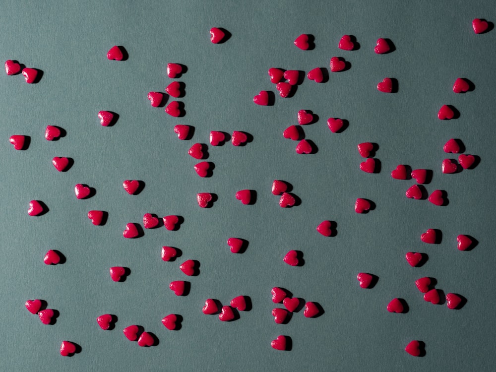 a group of red hearts on a gray background