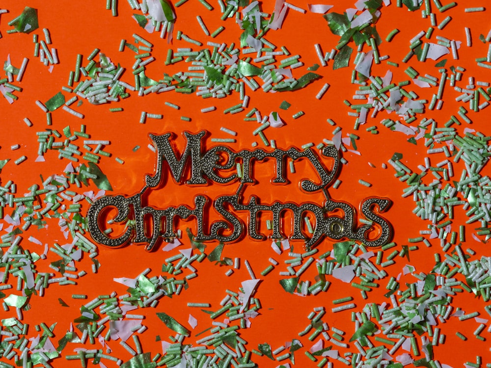 a merry christmas message surrounded by confetti
