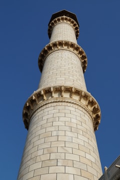 The Royal Costa Tower rising elegantly against a clear blue sky.