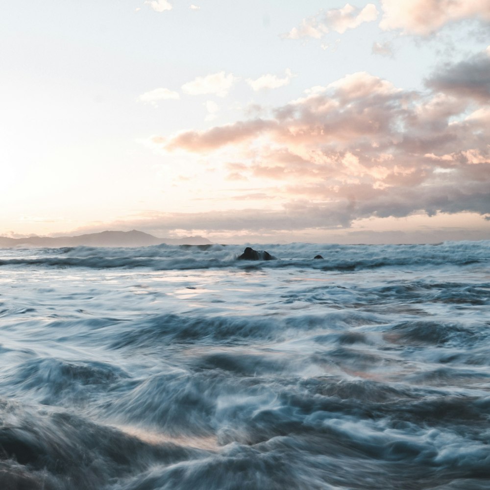 a large body of water with waves coming in