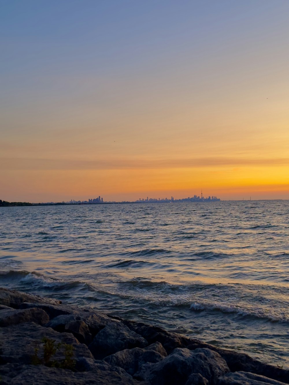 a view of a body of water at sunset