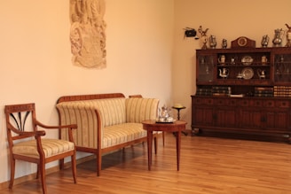 a living room filled with furniture and a wooden floor