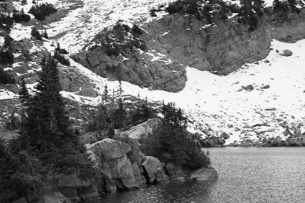 a black and white photo of a mountain lake