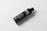 Close-up of a sleek black and gold Olaxis performance oil bottle glowing softly against a dark background.