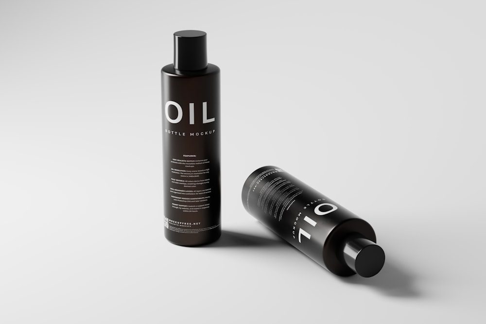 a bottle of oil next to a tube of oil