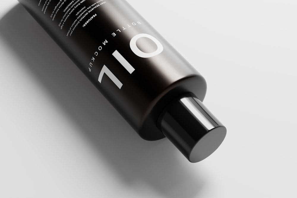 a tube of hair product on a white surface