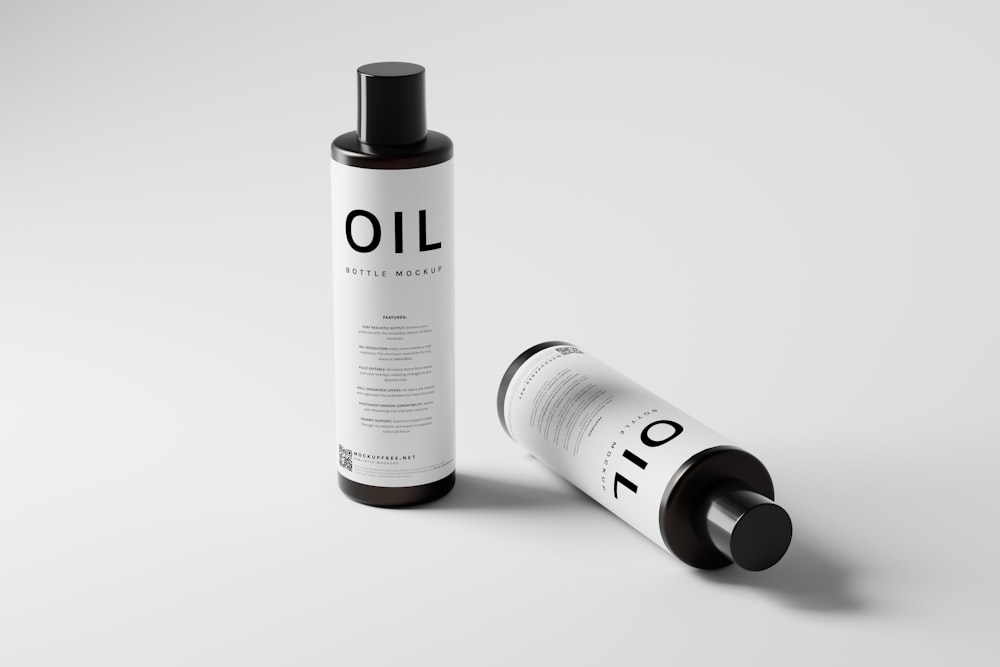 a bottle of oil next to a tube of oil