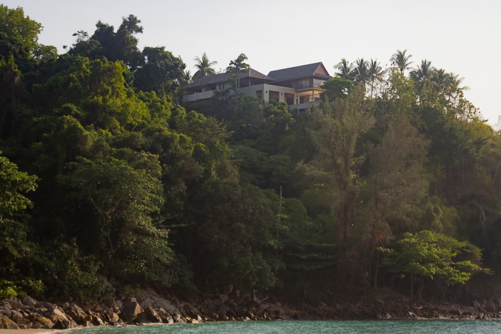 a house on a hill overlooking a body of water