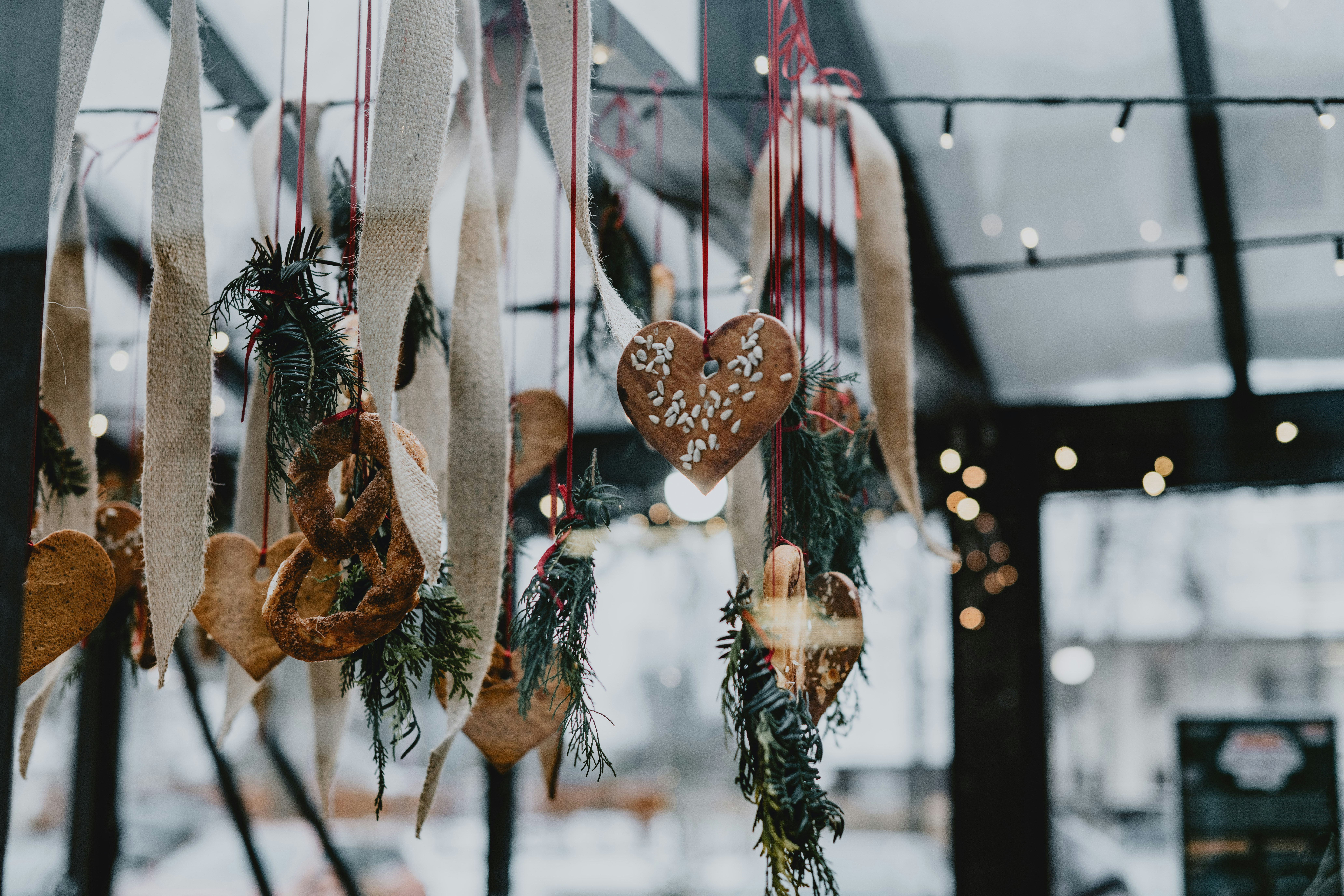 A group of christmas decorations hanging from a ceiling photo – Free  Christmas Image on Unsplash, image size:3000x2000