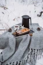 A cozy setup with blankets and hot drinks being shared with those in need.