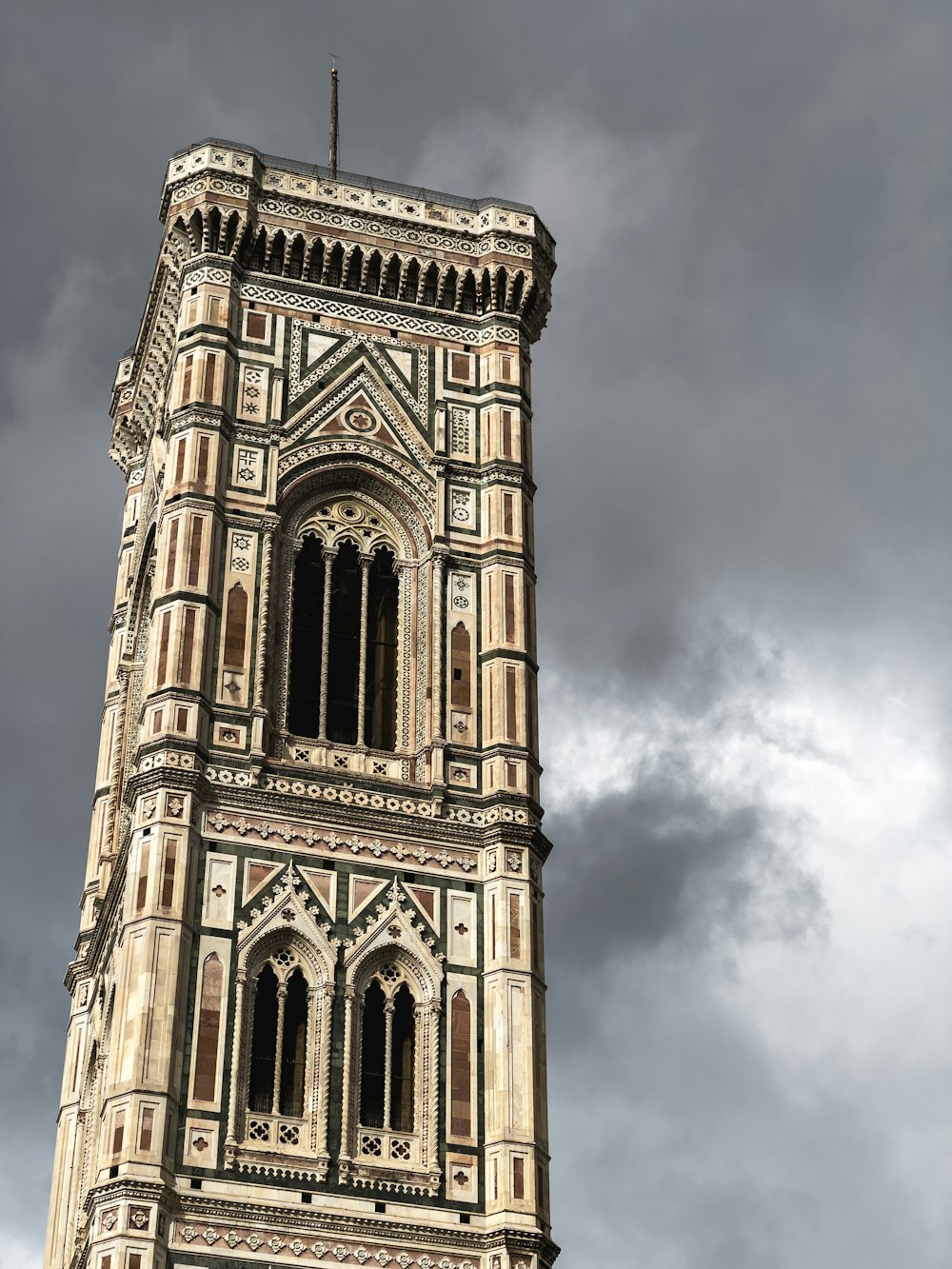 a tall tower with a clock on the top of it