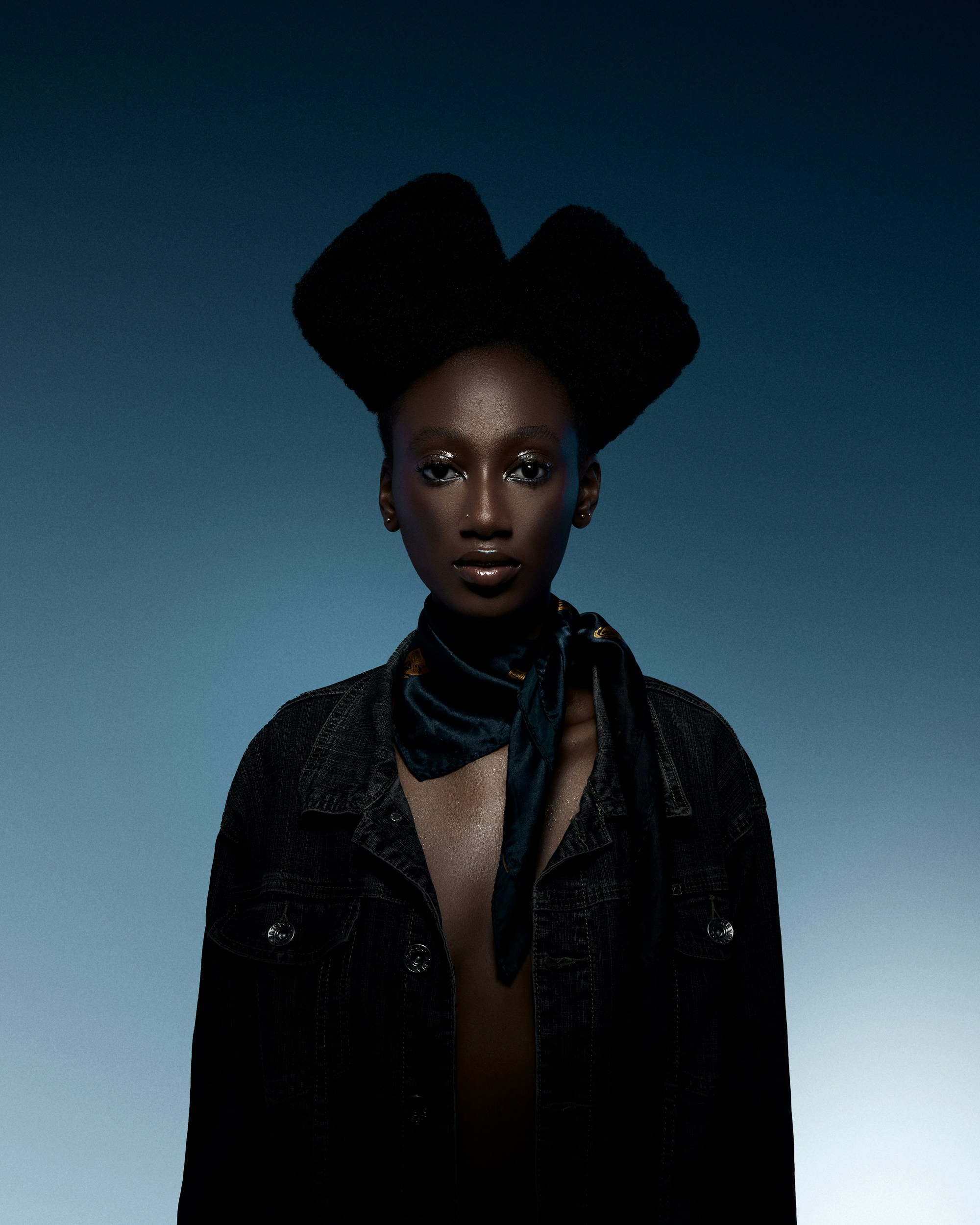 Editorial fashion shot of a model in a cityscape.