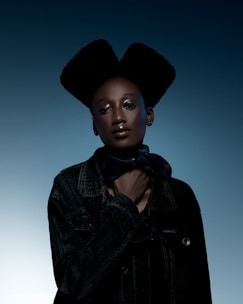 A sleek digital portrait of a confident real estate agent with a deep navy and gold gradient background.