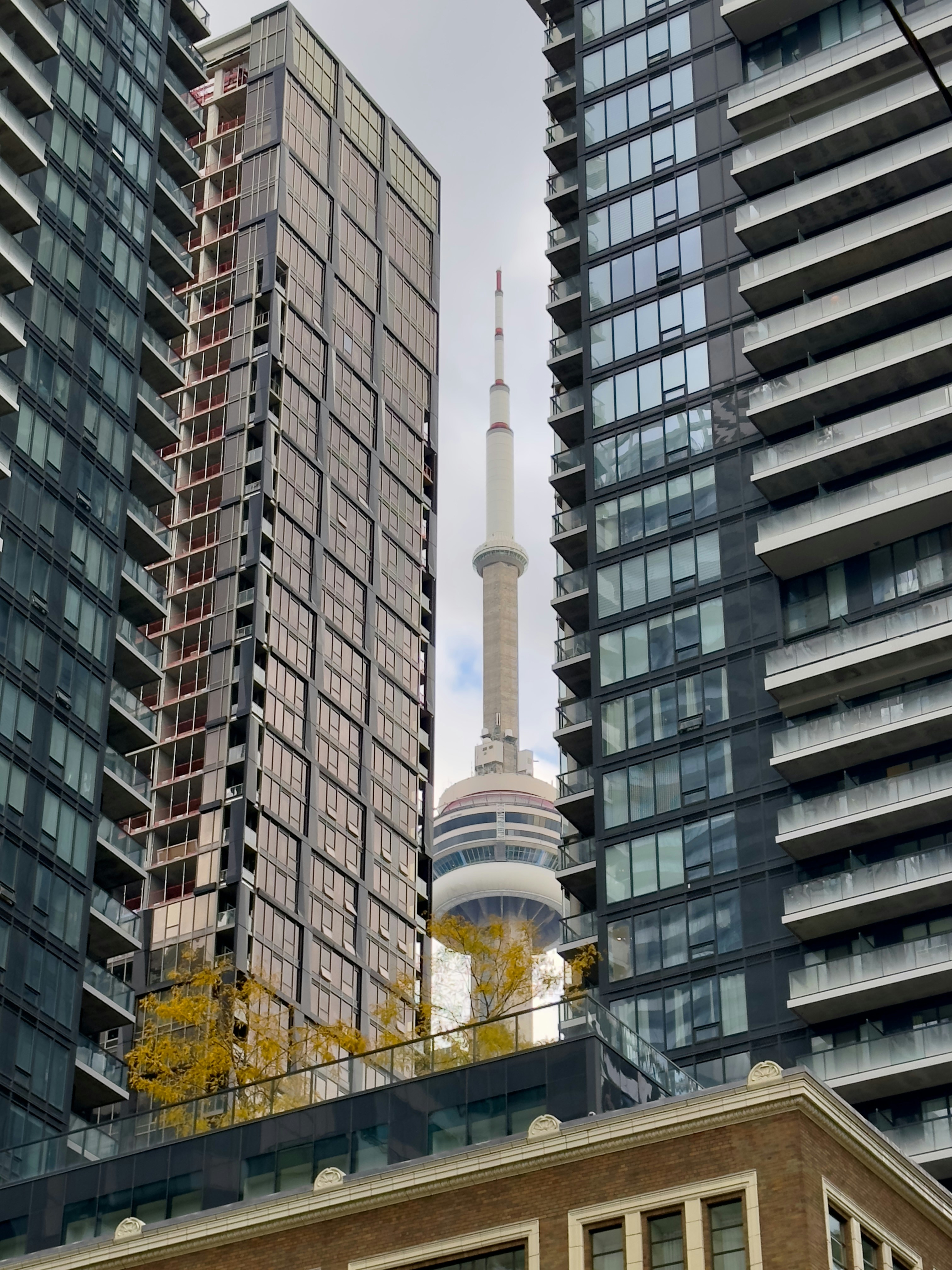 a tall building with a tower in the background