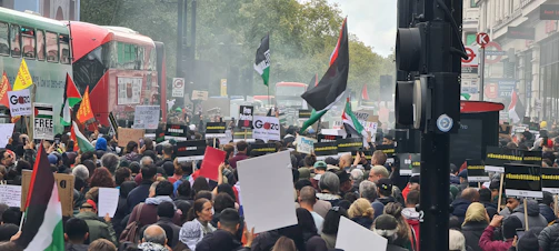 An outdoor scene of a peaceful political demonstration in the city.