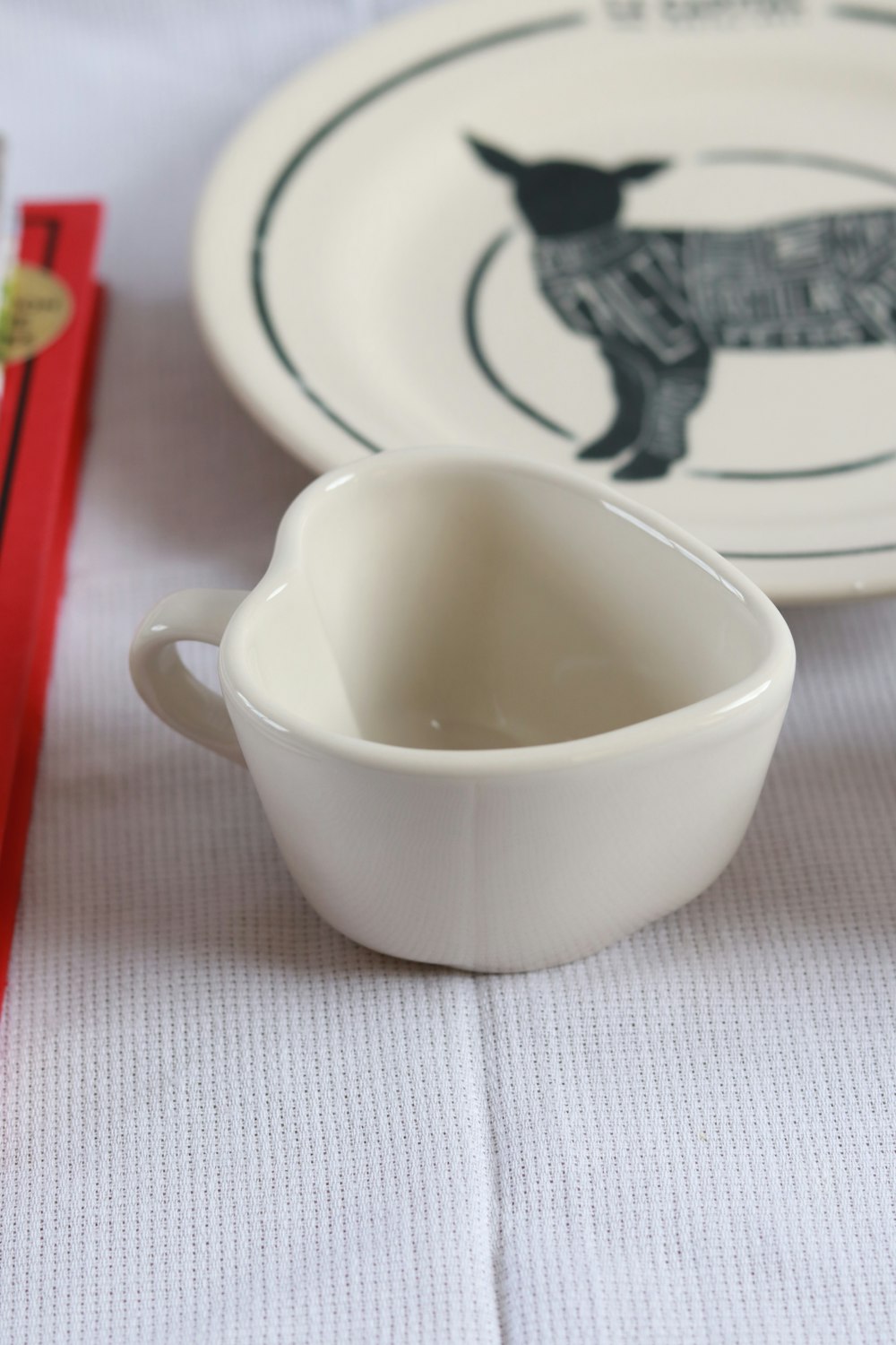 a small white bowl sitting on top of a table