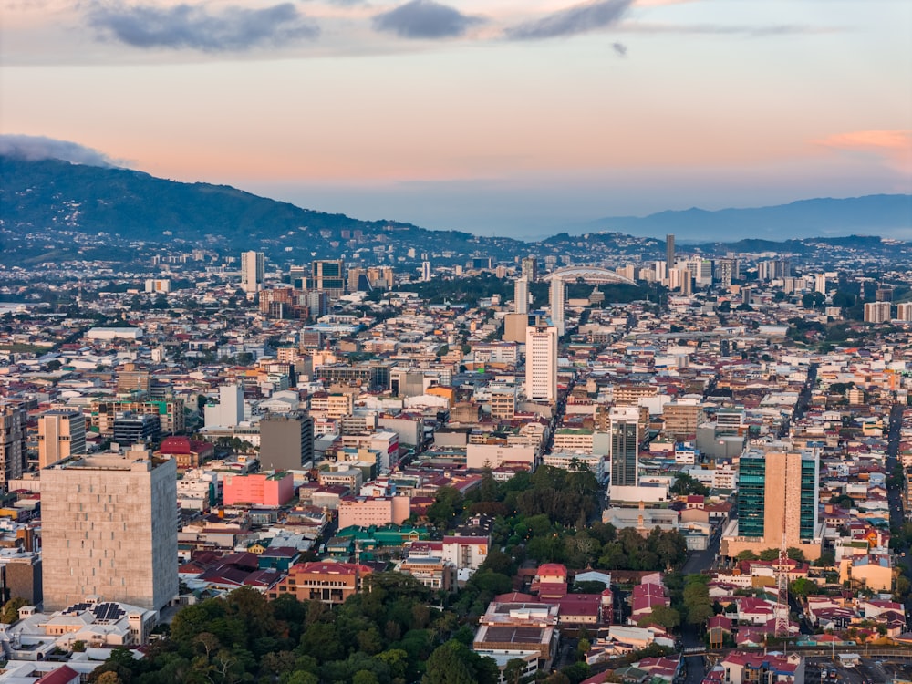 a view of a city with mountains in the background