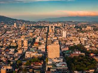 an aerial view of a city with tall buildings