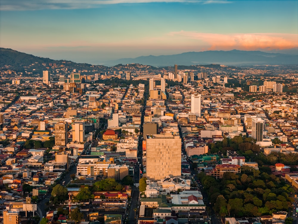 an aerial view of a city with tall buildings