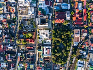 An aerial view of an urban master plan showing green spaces and organized street grids.