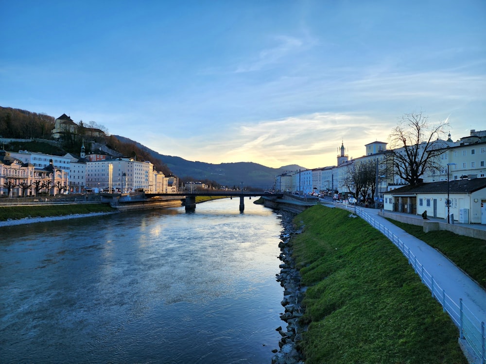 a river running through a city next to a bridge