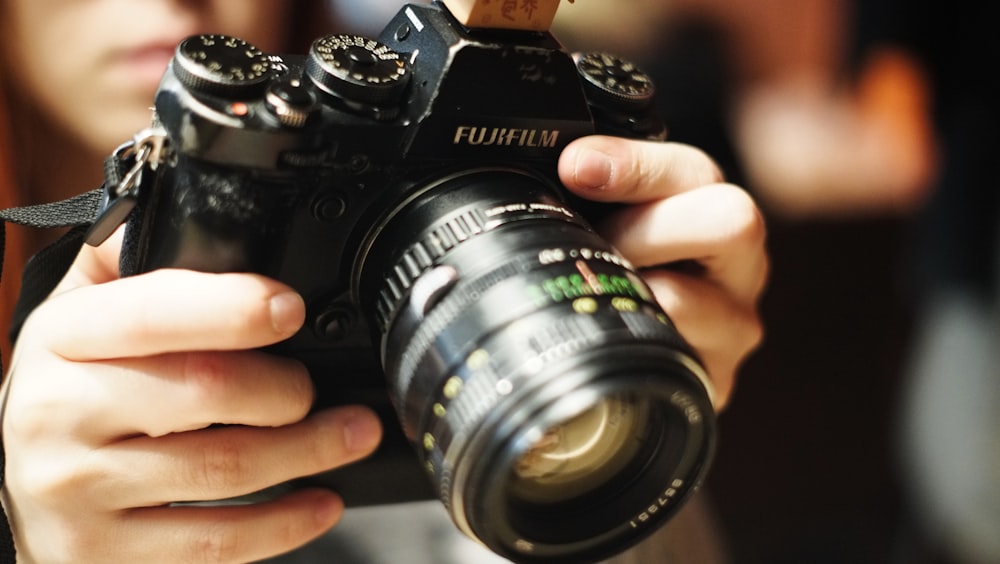 a woman taking a picture with a camera