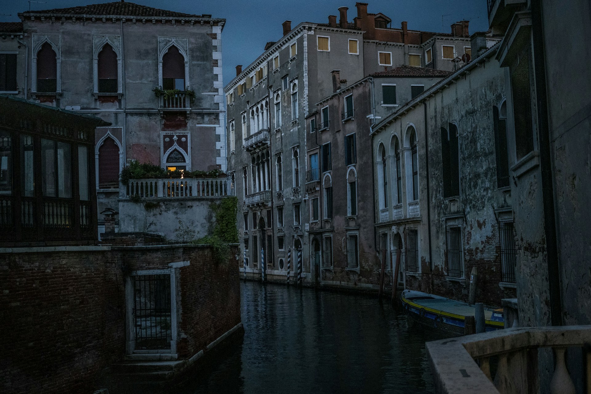 a river running through a city next to tall buildings