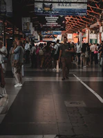 A busy market scene with banners announcing special deals and discounts.
