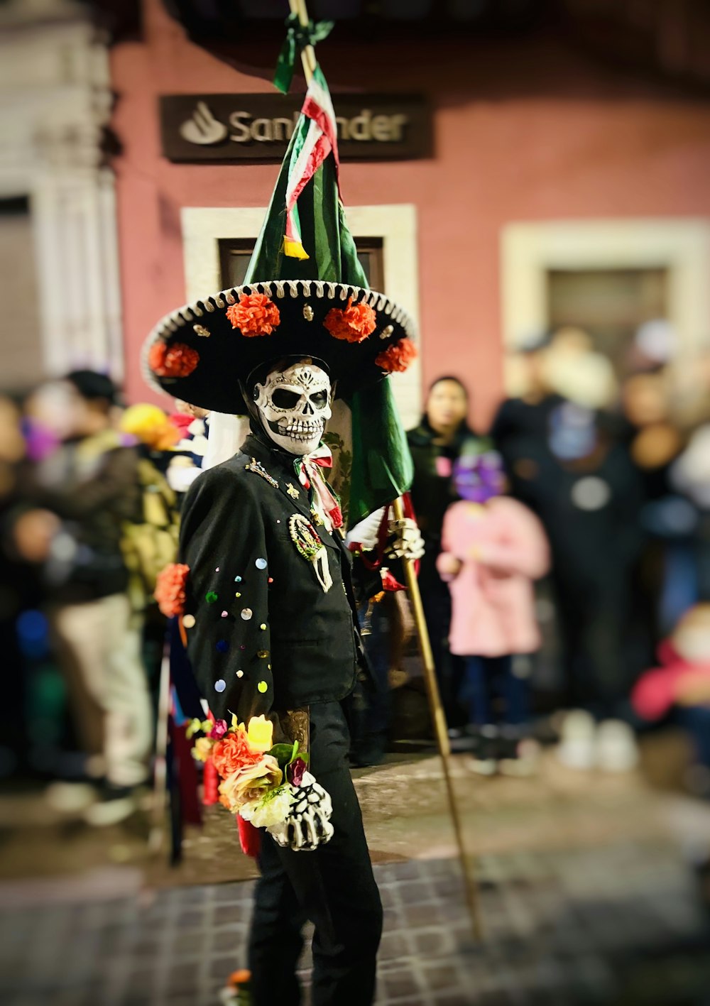 a man in a sombrero with a mexican flag on his head
