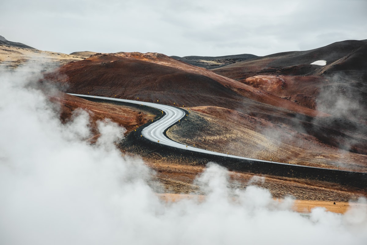 A winding road seen across the Myvatn Geothermal Area, Iceland