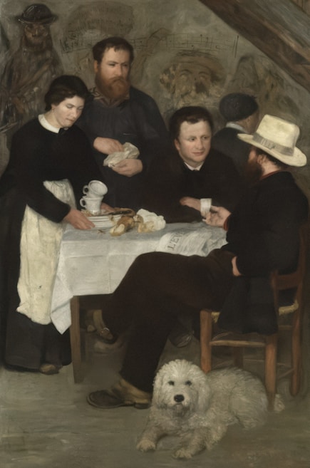 A group of four men and a woman are gathered around a small table in a dimly lit room. The woman is serving tea, while two of the men are involved in conversation. The two other men are observing or preparing to engage in the discussion. A white fluffy dog lies on the floor in front, looking towards the viewer. The room has an old and rustic ambiance, with a wall featuring faint sketches or writing in the background.