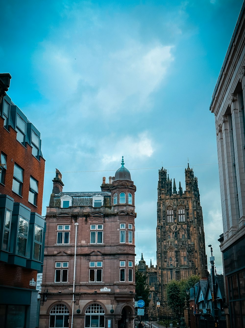 a tall building with a clock tower in the background