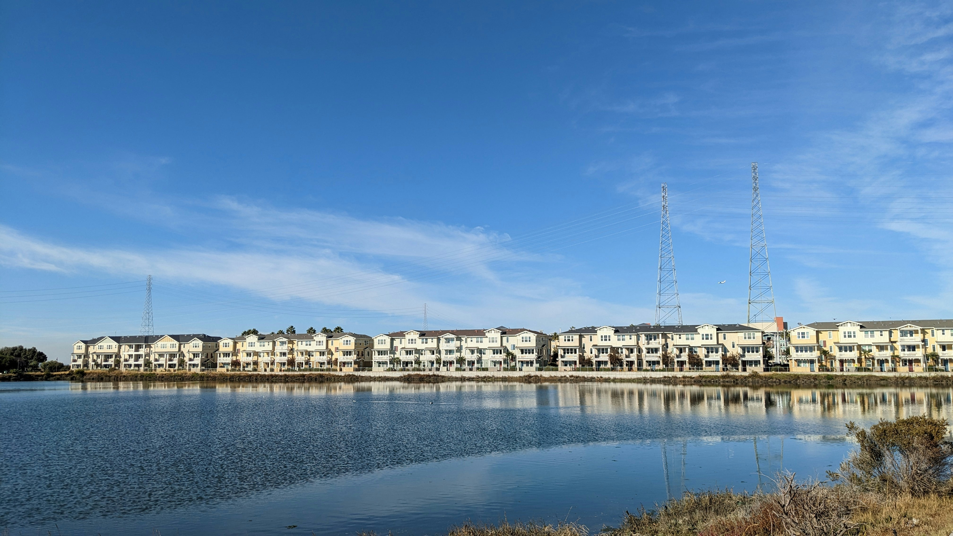 a body of water with a bunch of buildings in the background