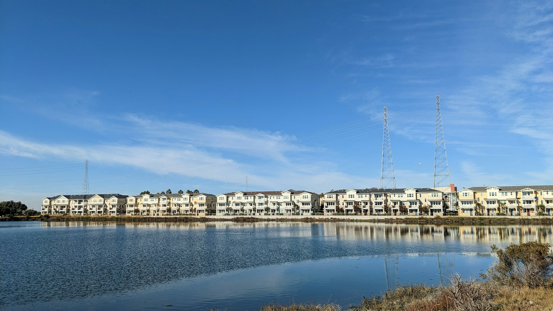 a body of water with a bunch of buildings in the background