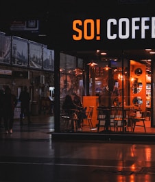 A cozy coffee shop with people enjoying coffee.