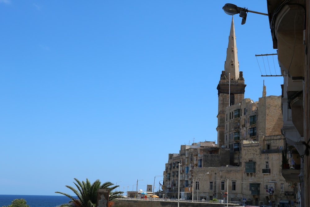 a view of a city with a church steeple in the background