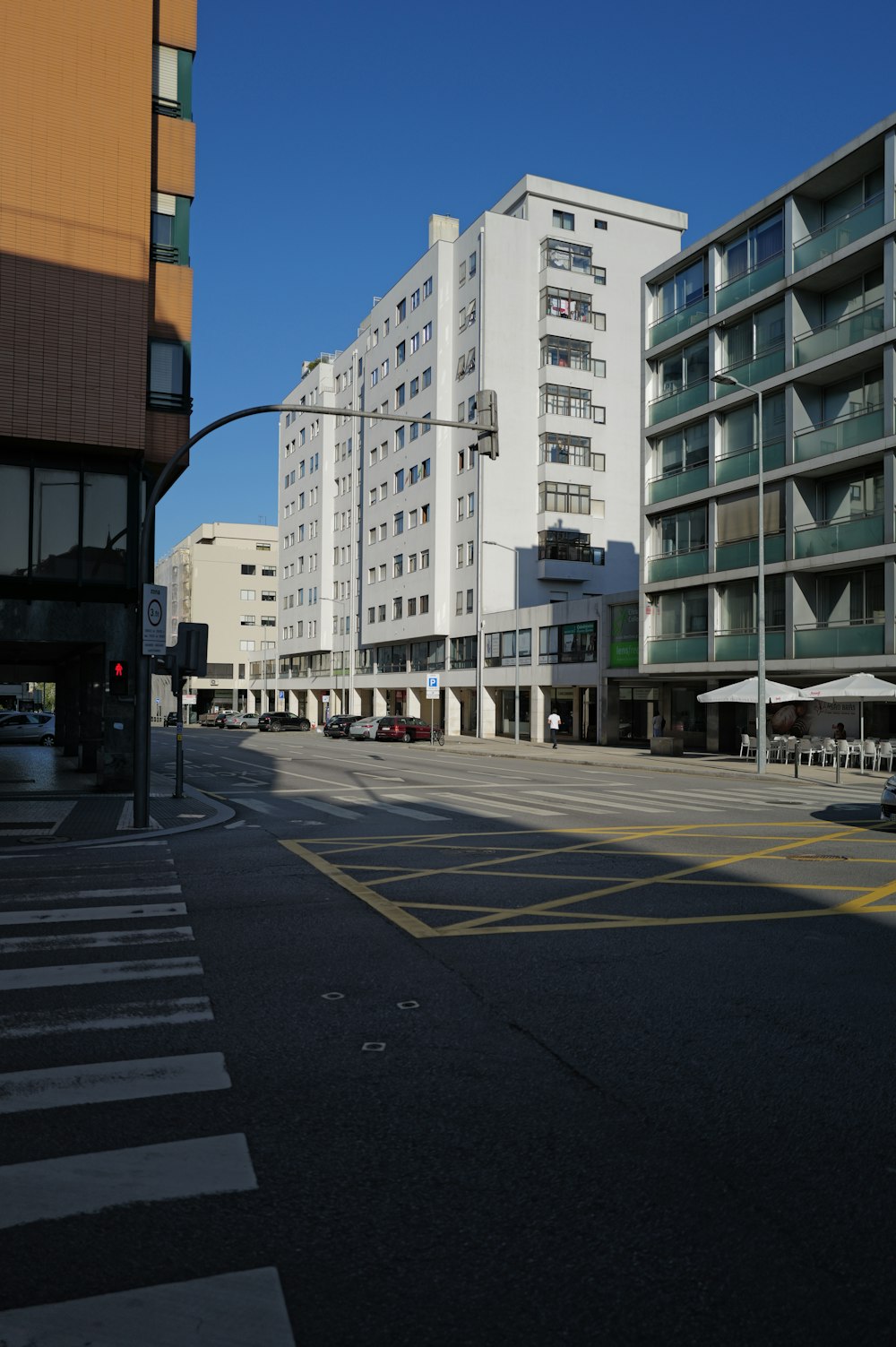 an empty street in a city with tall buildings
