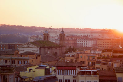 Sunset view over the historic Olinda with colonial buildings bathed in golden light.