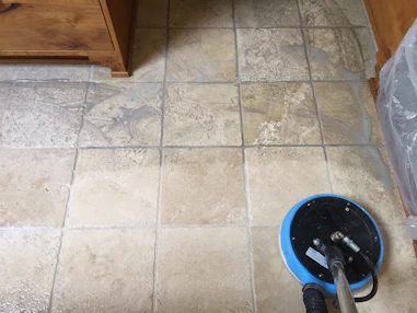 Before and after shots of grout cleaning and sealing in a tiled bathroom.