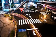 Night view of illuminated pedestrian crossings enhancing safety in an urban area.