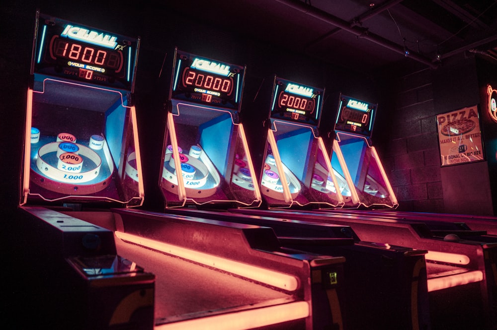 a row of arcade machines sitting next to each other