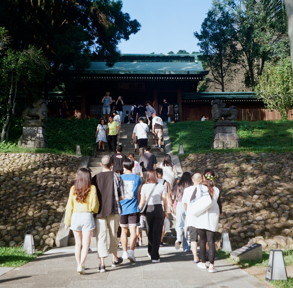 a group of people walking up a set of stairs