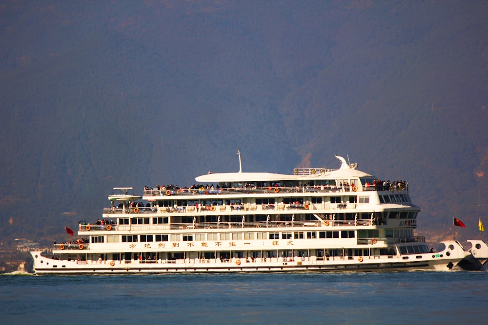 a large white boat floating on top of a body of water